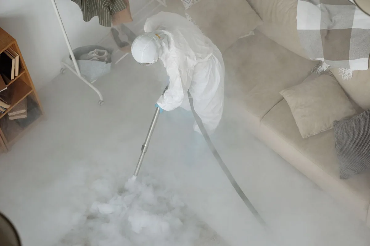 Biohazard cleanup technician in protective equipment, Cowan, TN
